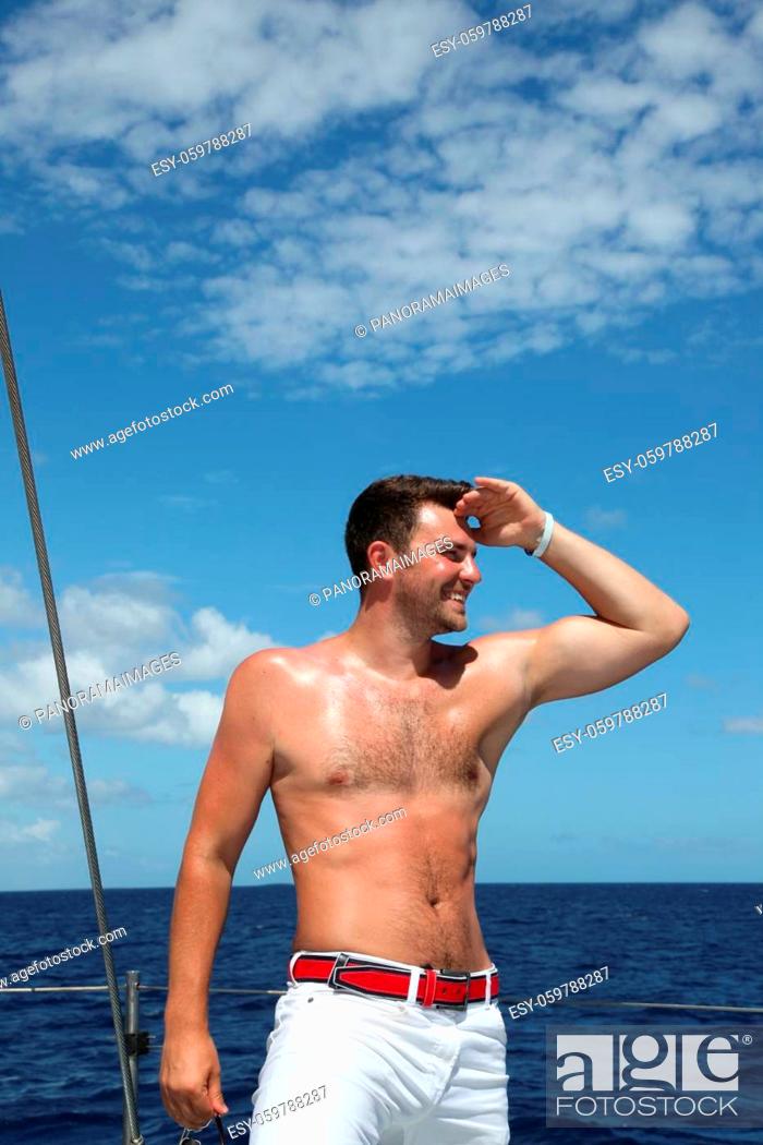 Stock Photo: Man enjoying summer time holiday on sailing boat.