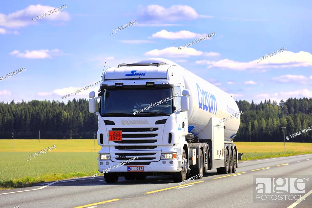 Stock Photo: White Scania semi tank truck Gasum hauls LNG, Liquified natural gas, ADR 223-1972, on Highway 2 in the summer. Jokioinen, Finland. August 14, 2020.