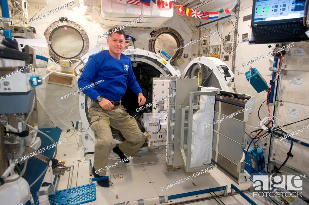 Stock Photo: NASA astronaut Shane Kimbrough floats next to the airlock inside the Japanese Experiment Module aboard the International Space Station.