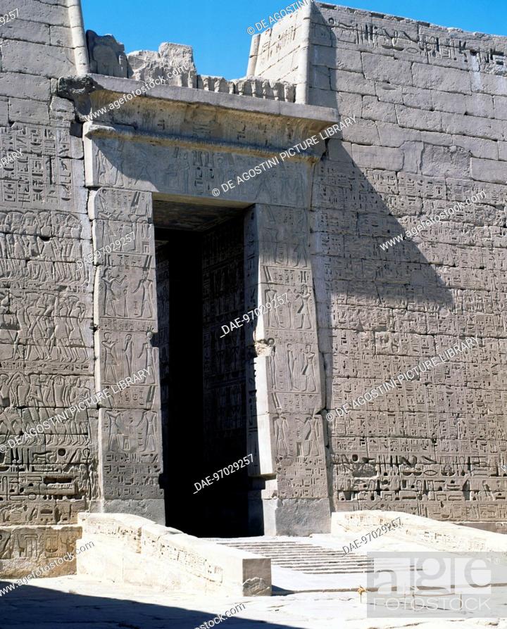 Stock Photo: Door molding in pink granite, second pylon of the Mortuary Temple of Ramesses III, Medinet Habu, Thebes (Unesco World Heritage List, 1979).