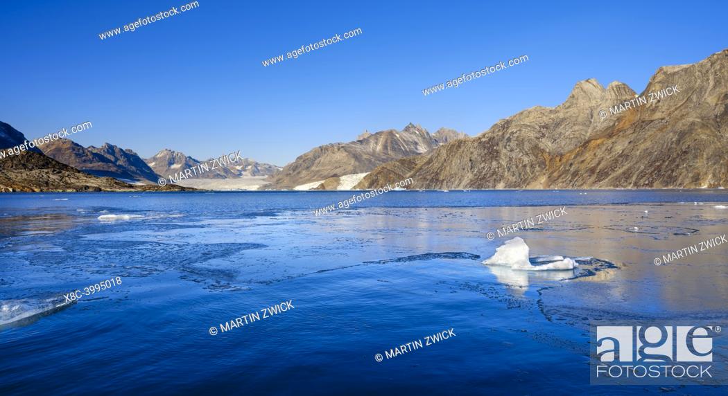 Stock Photo: Karale glacier in the Sermiligaaq Fjord, fresh sea ice in the foreground. Ammassalik region in the north east of Greenland.