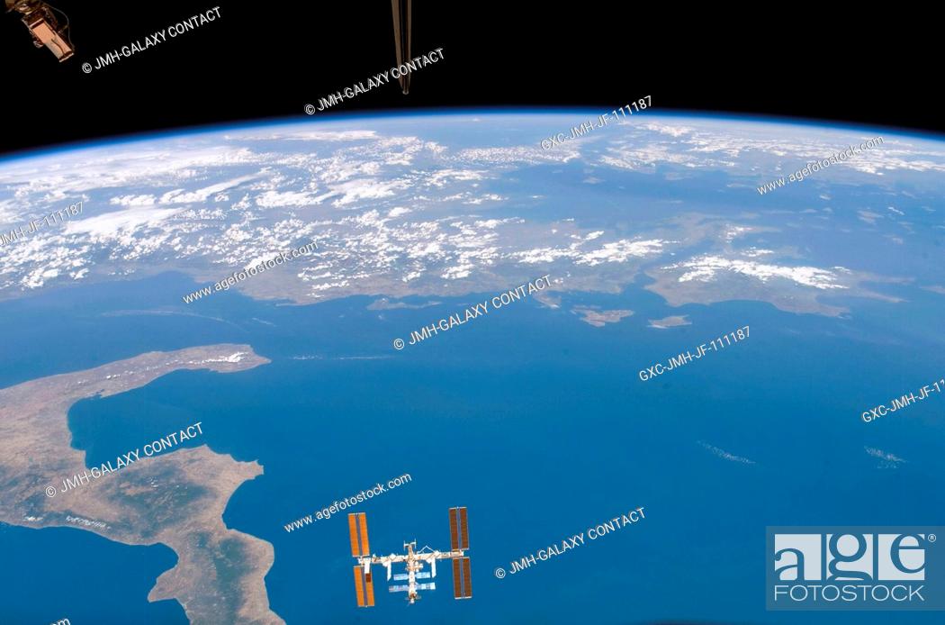 Stock Photo: The International Space Station is featured in this image photographed by a STS-118 crewmember on the Space Shuttle Endeavour following the undocking of the two.