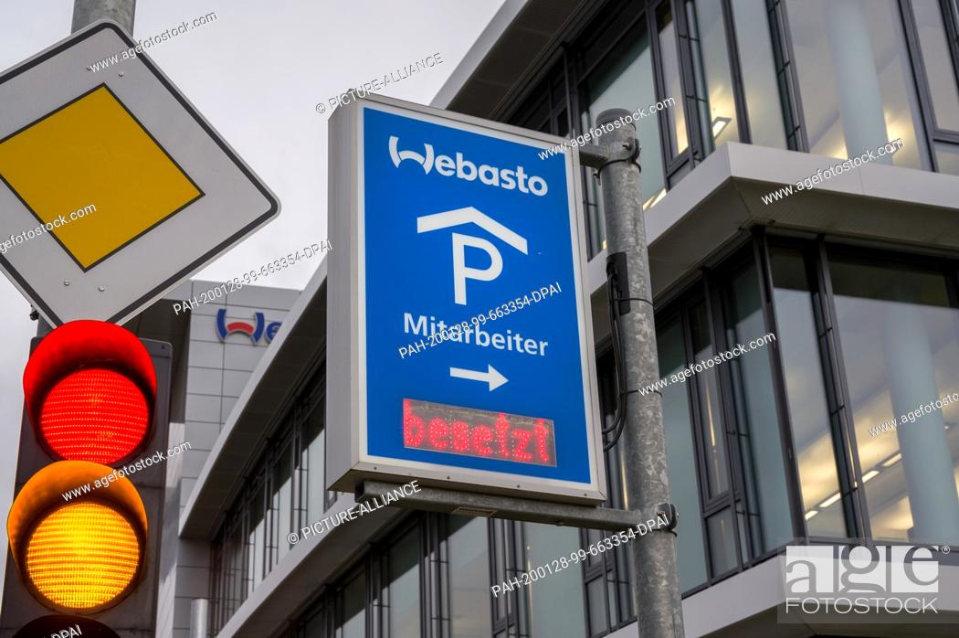 Stock Photo: 28 January 2020, Bavaria, Stockdorf: A sign on a parking garage at the main building of the Webasto company. In Germany, an infection with the novel coronavirus.