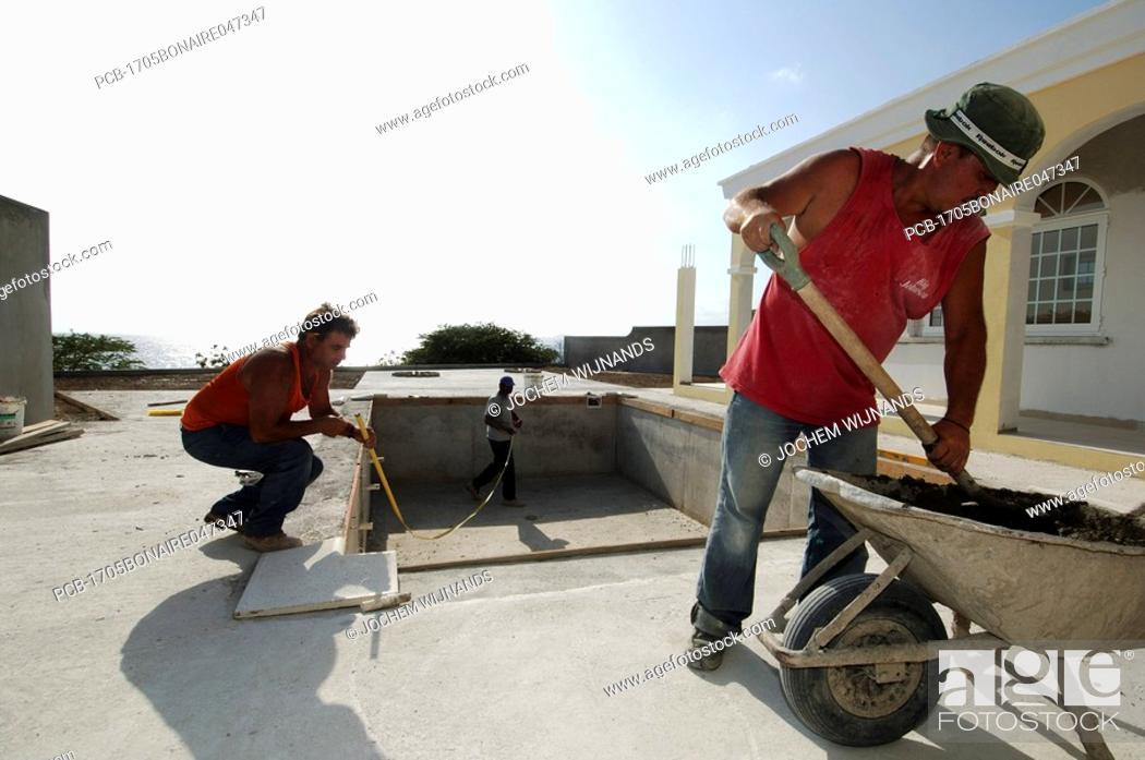 Stock Photo: Netherlands Antilles, Bonaire, south american construction workers working on a housing project.