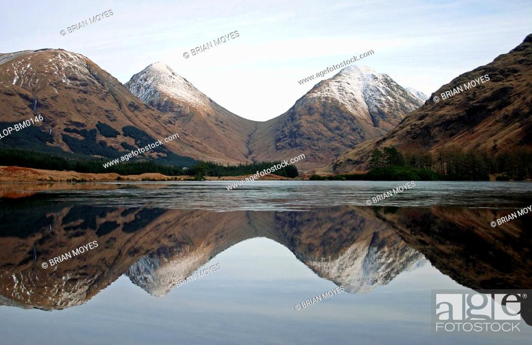 Stock Photo: Scotland, Highland, Glen Coe, Snow capped mountain reflection with ice at Glen Etive.