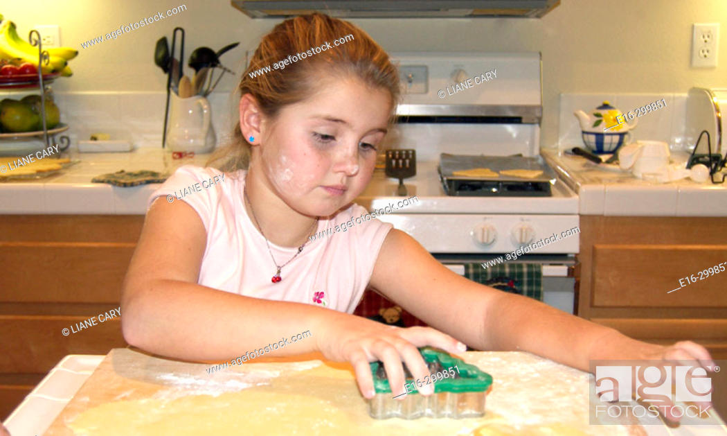 Stock Photo: girl baking cookies.