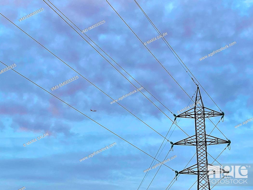 Stock Photo: Electricity pylon and cloudy sky.