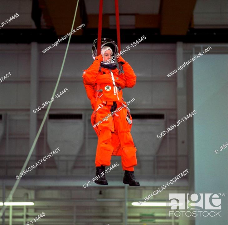 Stock Photo: Astronaut Ellen Ochoa, mission specialist, simulates a parachute drop into water during emergency bailout training with her STS-96 crew mates.