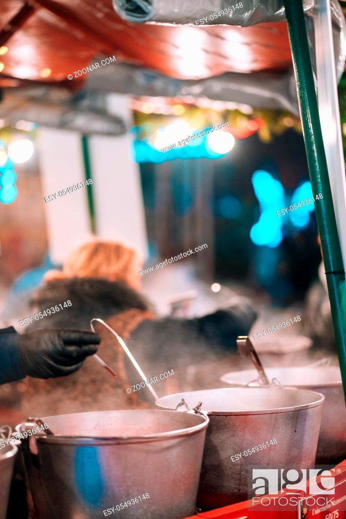 Photo de stock: Several pans with steam from the food at street food festival.