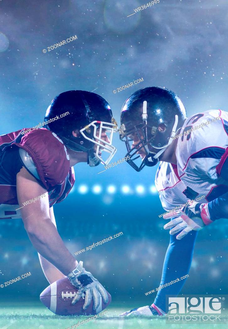 Stock Photo: american football players are ready to start a match on modern field at night.