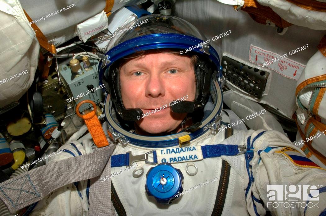 Stock Photo: Cosmonaut Gennady Padalka, Expedition 20 commander, attired in a Russian Sokol launch and entry suit, occupies his seat in the Soyuz TMA-14 during final.