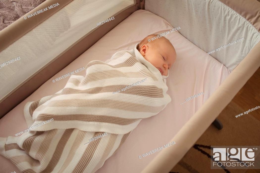 Stock Photo: Baby sleeping in crib.
