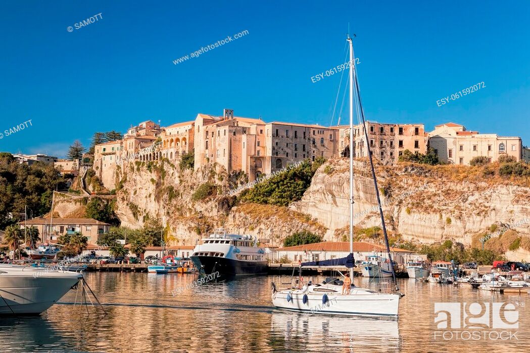 Stock Photo: Tropea town with sailboats leaving the port inTropea, Vibo Valentia, Calabria, Southern Italy.