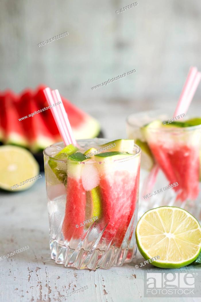 Stock Photo: Fresh mineral water with watermelon, lime and ice in glasses.
