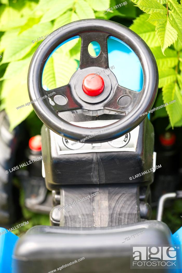 Stock Photo: Steering wheel and seat of plastic toy car.