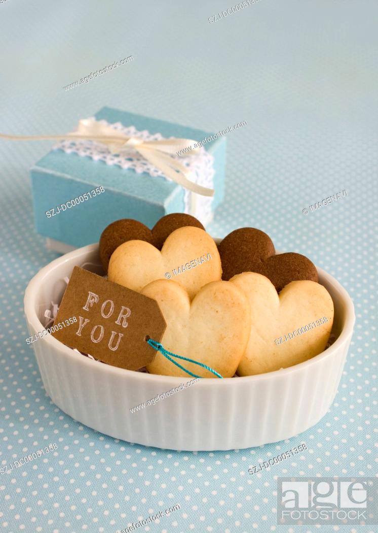 Stock Photo: Heart-shaped cookies and a gift box.