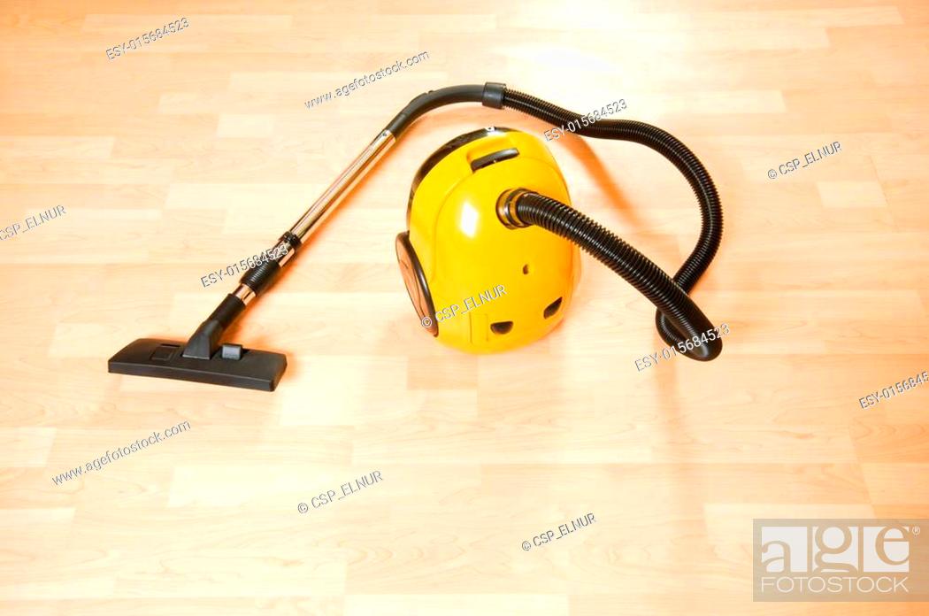 Vacuum Cleaner On The Polished Wooden Floor Stock Photo Picture