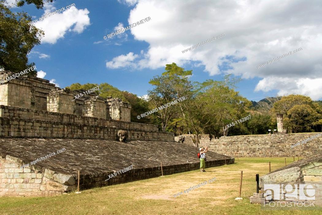 Stock Photo: Ball Court, tourist taking a photograph, Copan archaeological park, Copan Ruinas, Honduras.