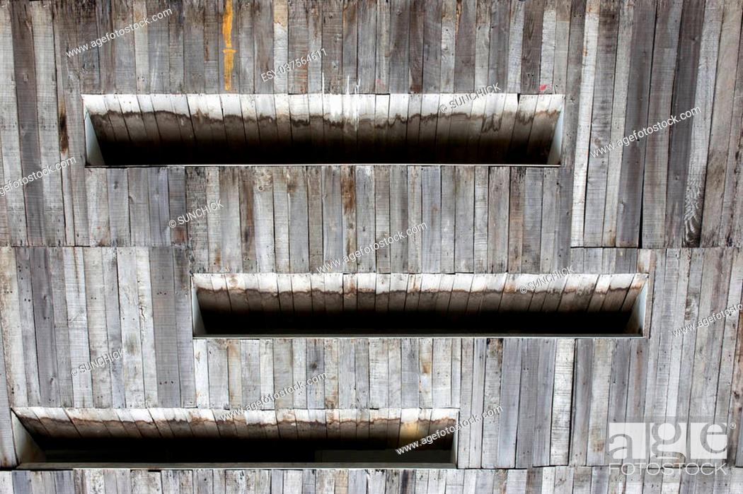 Stock Photo: shuttered window of a log cabin background.