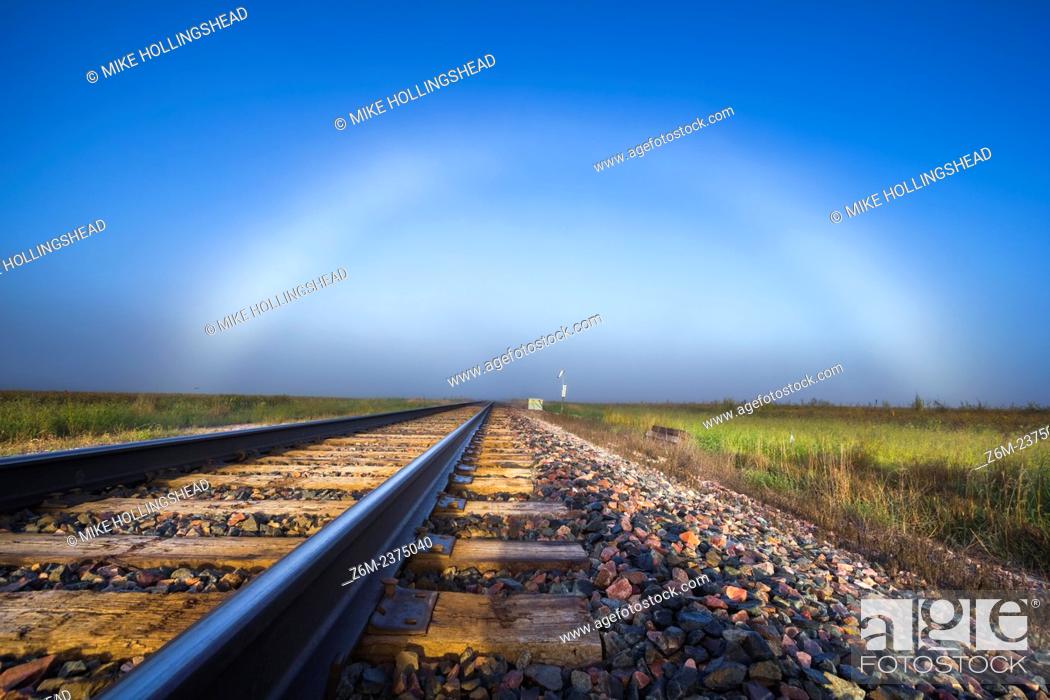 Stock Photo: Fogbow forms in western Iowa over some train tracks.