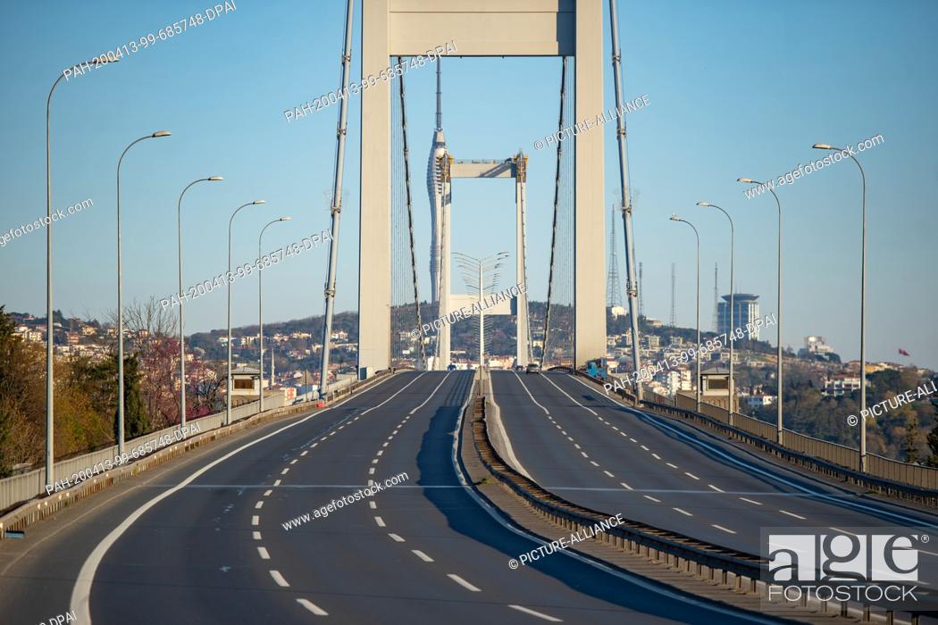 Stock Photo: 12 April 2020, Turkey, Istanbul: The Bosporus Bridge (Bridge of the Martyrs of July 15) is deserted during the two-day curfew imposed by the Turkish government.