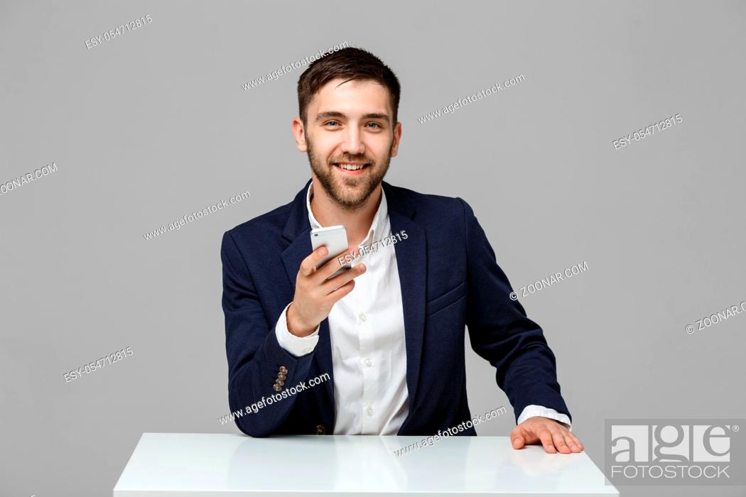 Stock Photo: Business Concept - Portrait Handsome Business man playing phone with smiling confident face. White Background.Copy Space.