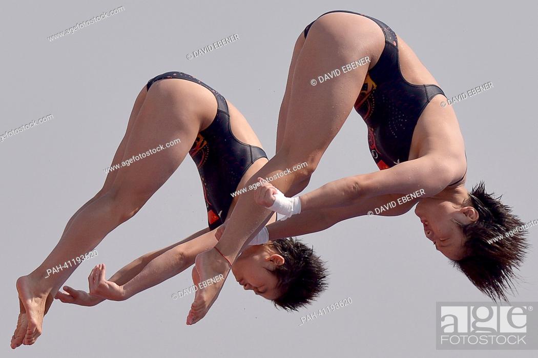 Stock Photo: Huixia Liu and Ruolin Chen of China in action during the women's 10m Synchro Platform diving preliminaries of the 15th FINA Swimming World Championships at.