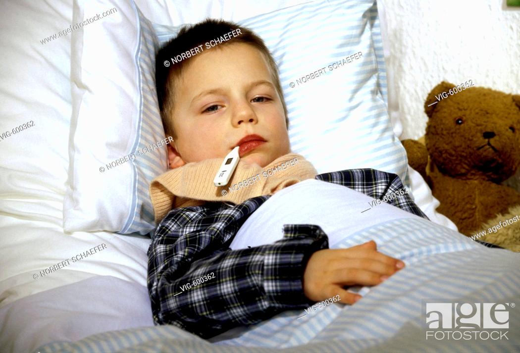 Stock Photo: Sick boy is lying with temperature in his bed. - 12/12/2007.