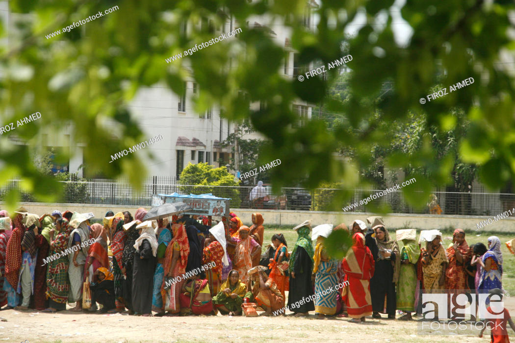 Stock Photo: A queue of people with low income, at a fair price shop, run by Bangladesh Rifles, BDR, in Ajimpur, Dhaka Bangladesh April 04, 2008.