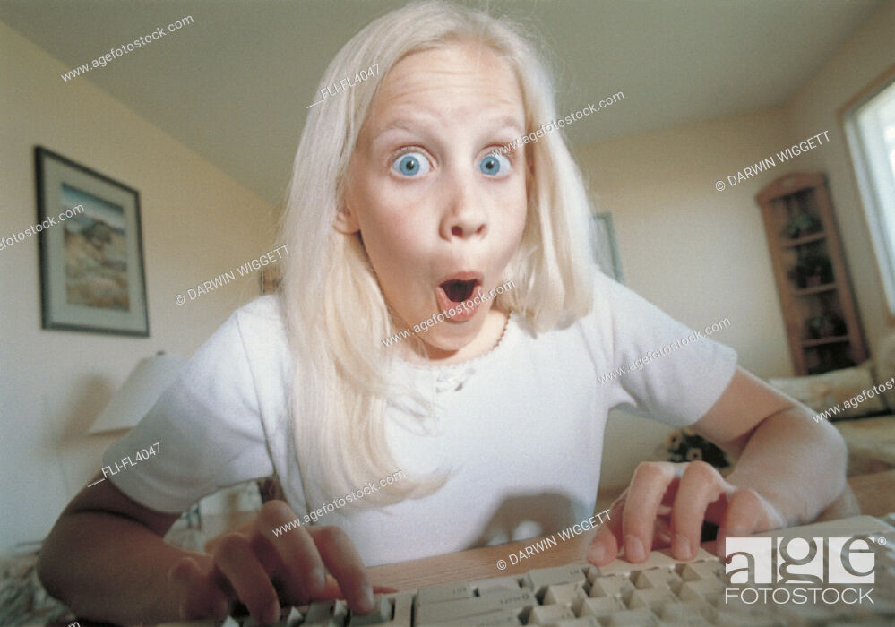 Stock Photo: Girl Using Computer, Surprised.
