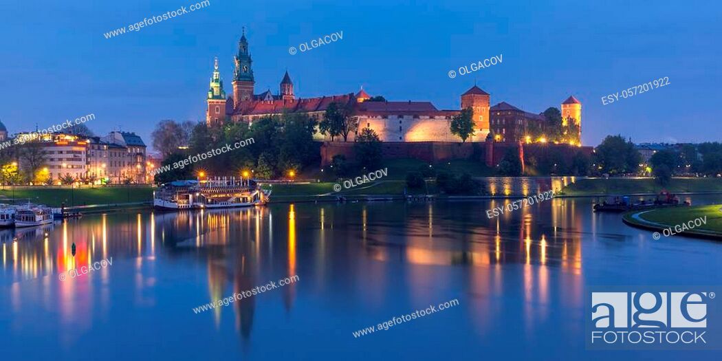 Stock Photo: Panorama of Wawel Castle on Wawel Hill with reflection in the river at night as seen from the Vistula, Krakow, Poland.