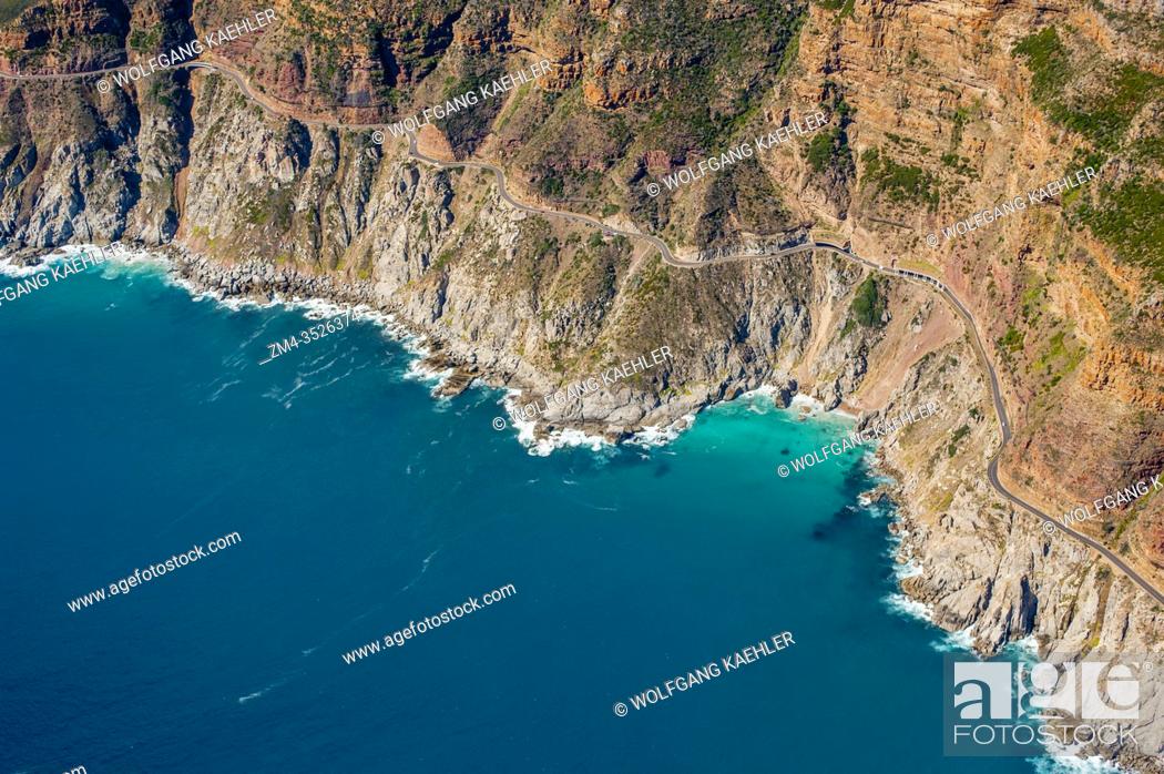 Stock Photo: Aerial view of the coastline of Hout Bay and Chapmanâ. . s Peak Drive toll road, which winds its way between Noordhoek and Hout Bay on the Atlantic Coast on the.