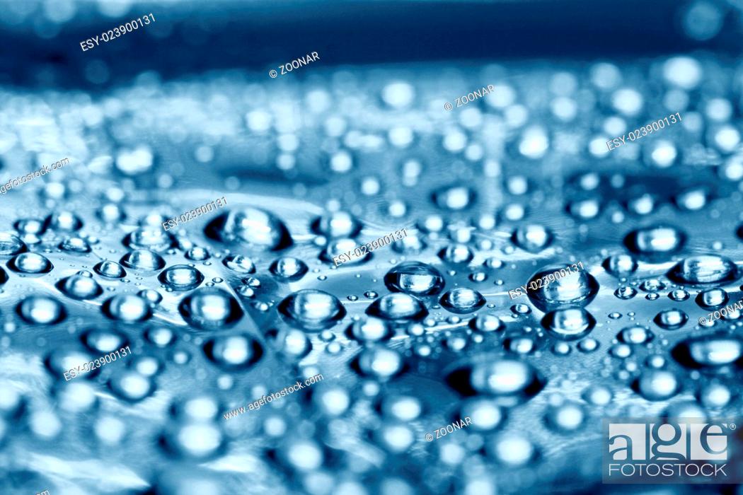 Stock Photo: clean blue waterdrops macro background.