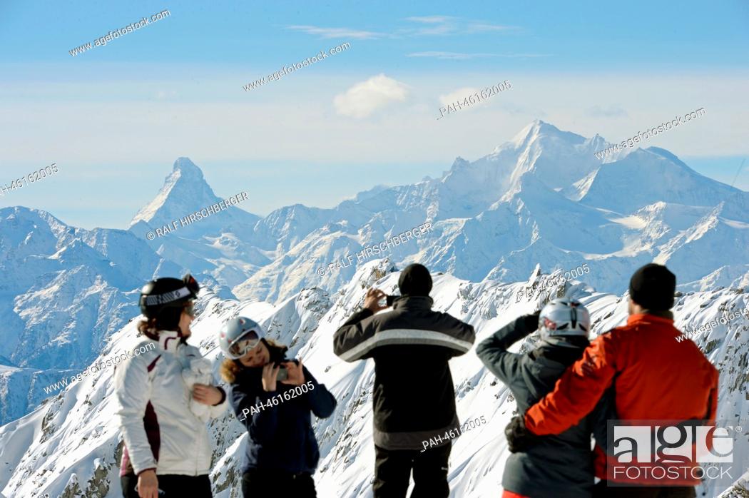 Stock Photo: Tourists look at the Alps with the Matterhorn (L) from the 2, 900 meter high Eggishorn on a sunny day in Fiesch, Germany, 06 February 2014.
