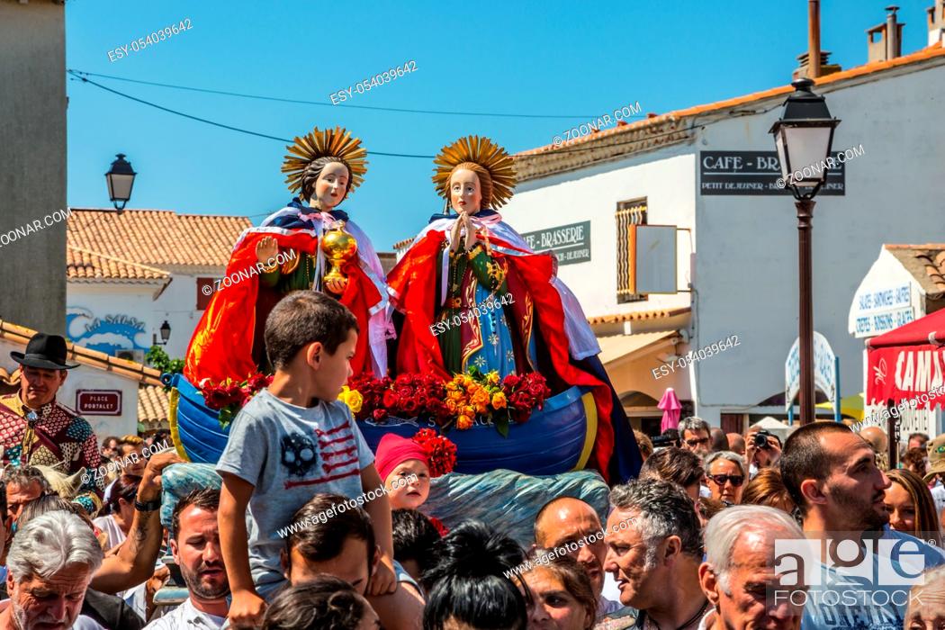 Stock Photo: Saintes-Maries-de-la-Mer, France - May 25, 2015. Christians accompany two statues of the Holy Maries. Religious feast in honor of the Holy Maries in Provence.