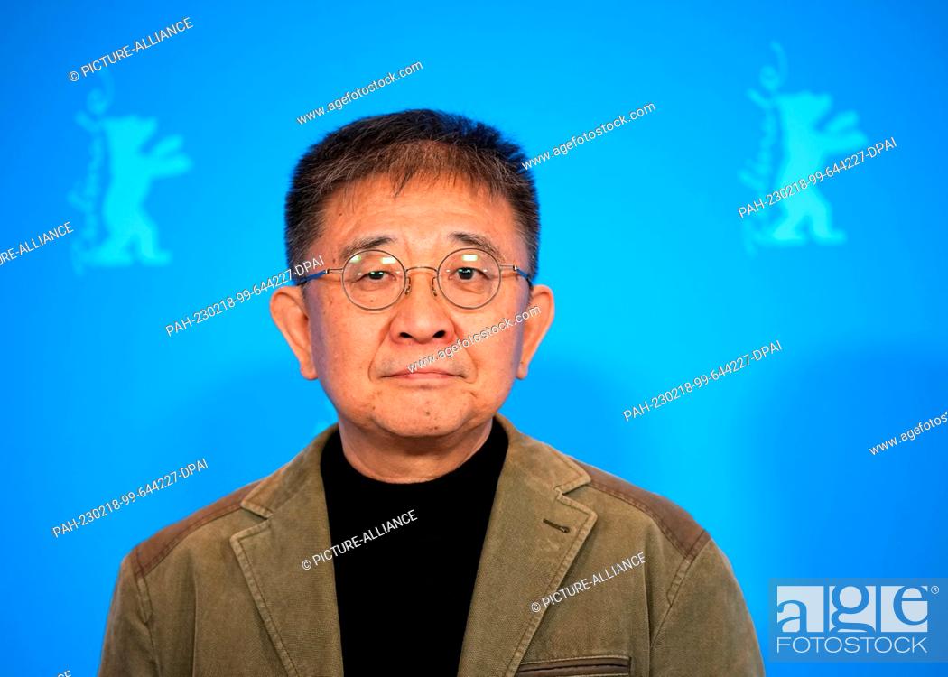 Stock Photo: 18 February 2023, Berlin: Director Zhang Lu stands in front of the blue wall during the photocall for the film ""The Shadowless Tower"".