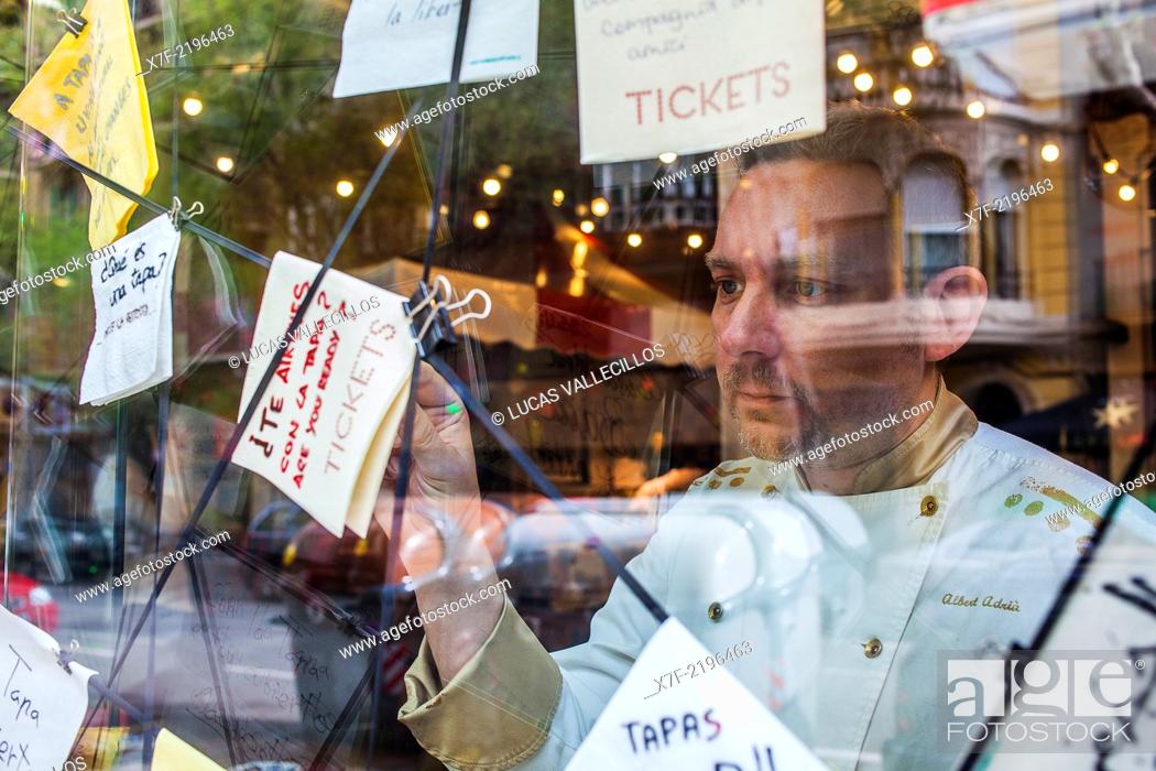 Stock Photo: Albert Adria observing window decoration , in Tickets Bar, AV del Paralelo 164, Barcelona, Spain.