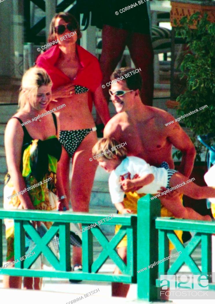 Stock Photo: Former German car driver Michael Schumacher photographed with his wife Corinna Betsch and his daughter Gine Marie during their summer holidays.