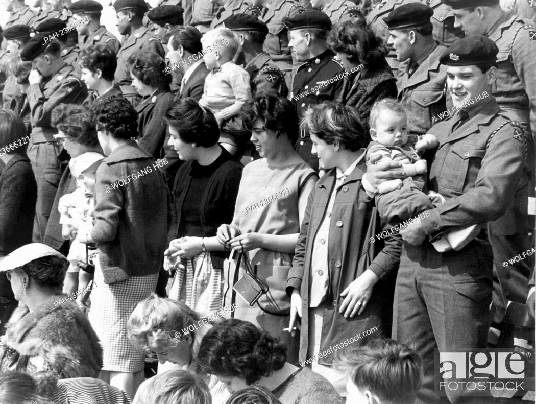 Stock Photo: In Germany stationed British soldiers watching a military parade of the York & Lancaster regiment with their families, who were on a visit.