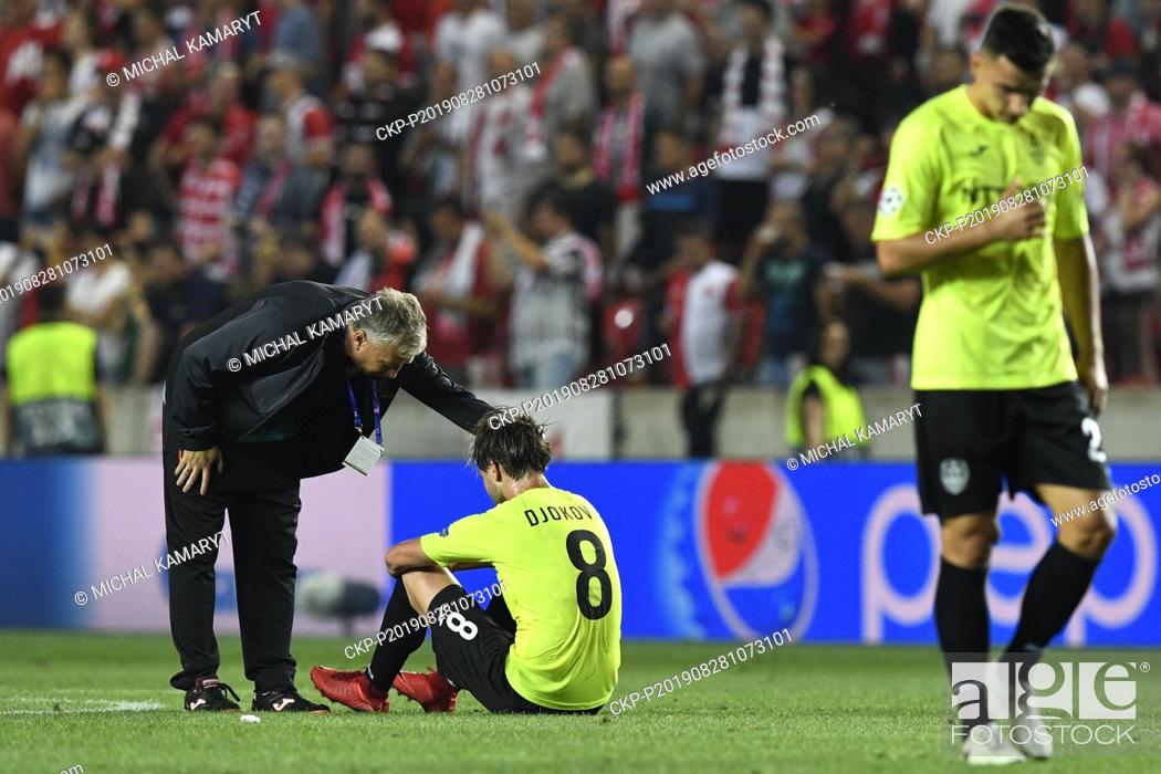 Stock Photo: From left coach of CFR Cluj DAN PETRESCU and soccer player DAMJAN DJOKOVIC after the Football Champions' League 4th qualifying round return match: Slavia Prague.