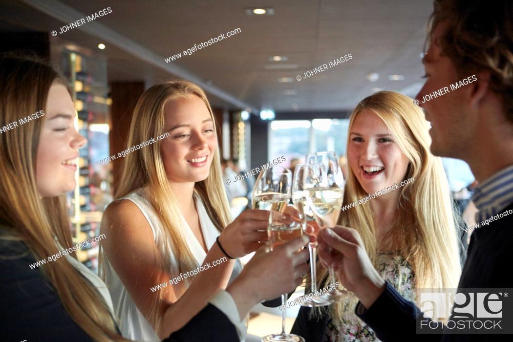 Stock Photo: Young friends having toast.