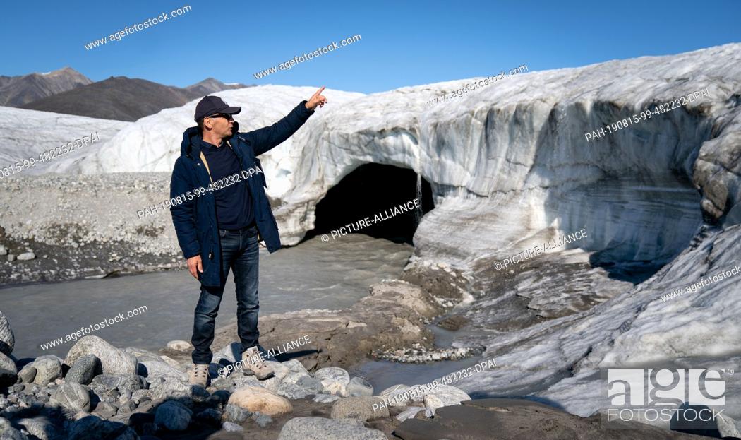 Stock Photo: 15 August 2019, Canada, Pond Inlet: Heiko Maas (SPD), Foreign Minister, visits a glacier near Pond Inlet in the Canadian Arctic.