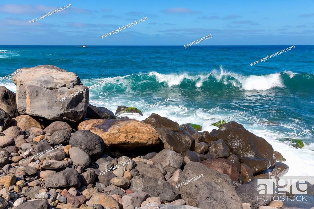 Stock Photo: Rocky coast of Madeira Island with breaking waves.