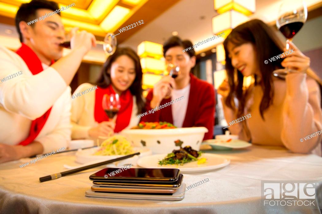 Stock Photo: Young people in the restaurant for dinner.