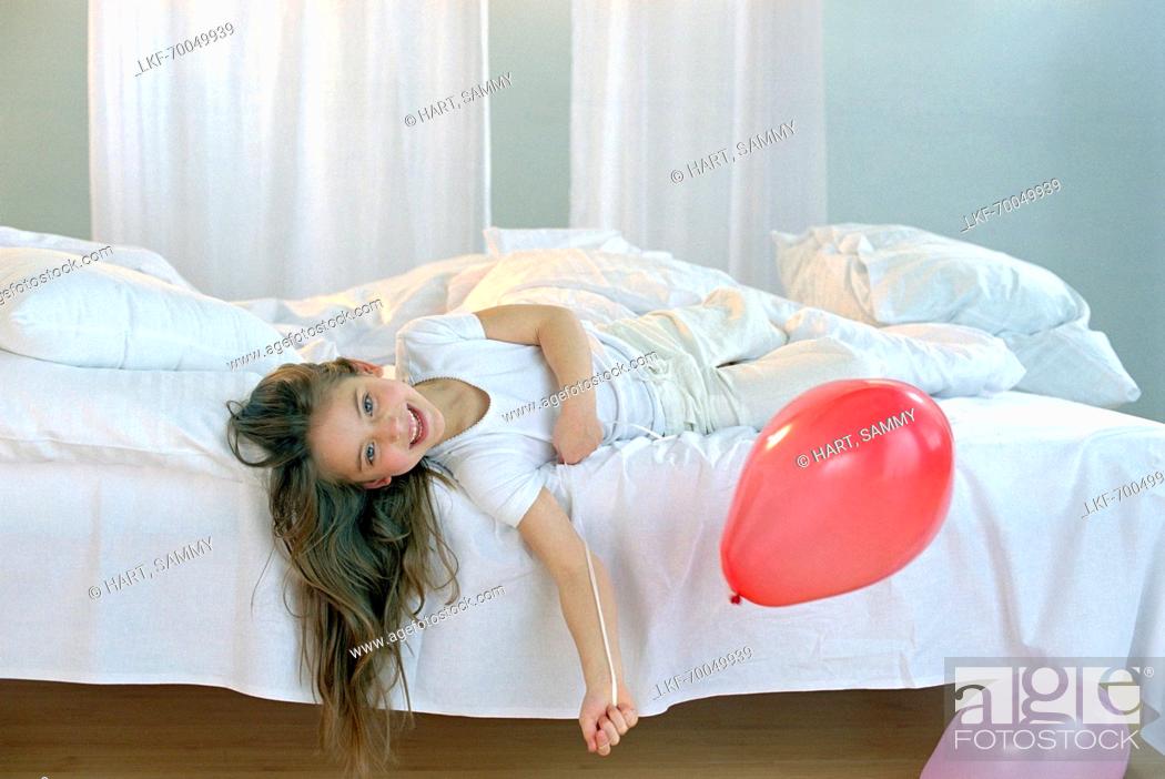 Stock Photo: Girl holding ballons.