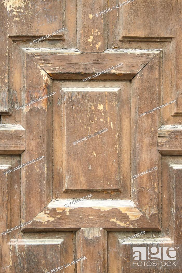 Stock Photo: Closeup of an old wooden door in Spain.