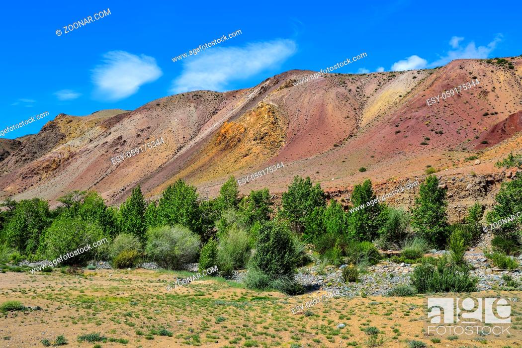 Stock Photo: View of unrealy beautiful multi-colorful clay cliffs in Altai mountains, Russia. Summer landscape, which is called Martian and Kyzyl-chin valley with boulders.
