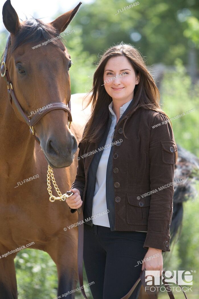 Stock Photo: Portrait of a woman with a horse, Kitchener, Ontario.