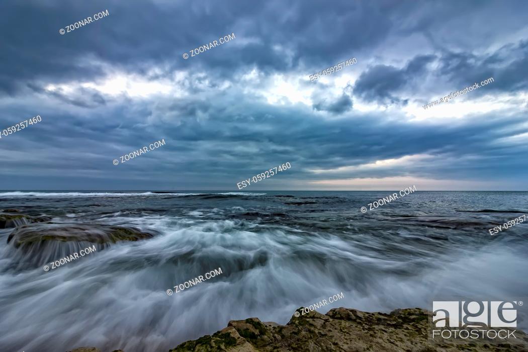 Stock Photo: amazing long exposure of the sea waves and rocks at the coast.