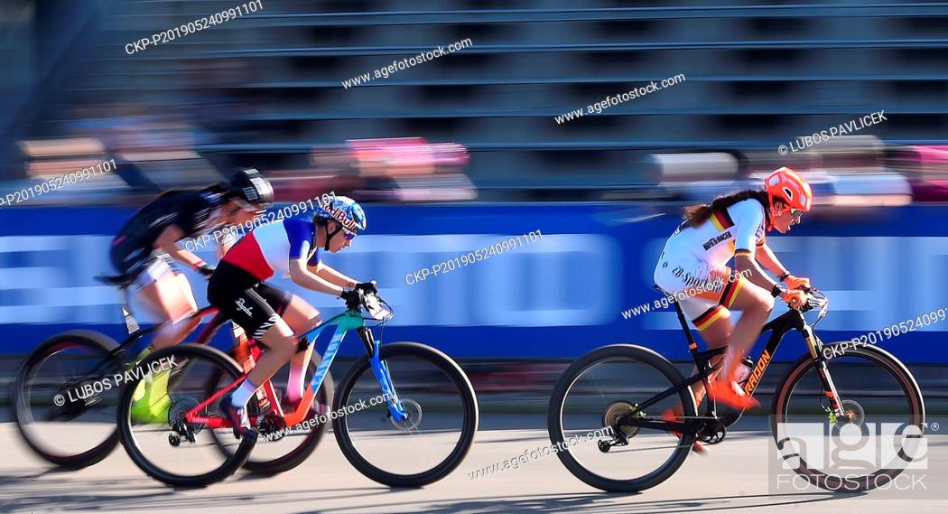 Stock Photo: From right PAULINE FERRAND-PREVOT of Germany and ELISABETH BRANDAU of France in action during the women elite Cross Country Mountain Bike World Cup event in.
